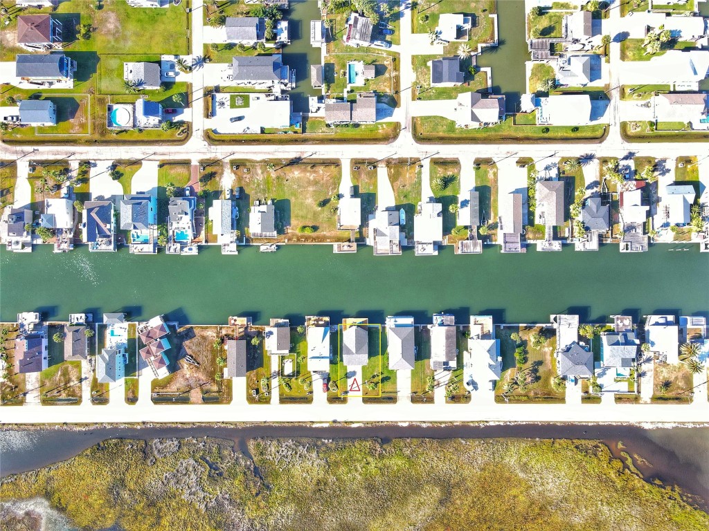 4729 Jolly Roger Road Jamaica Beach, TX 77554 - Photo 41 of 45 a room with lots of flowers and fruits