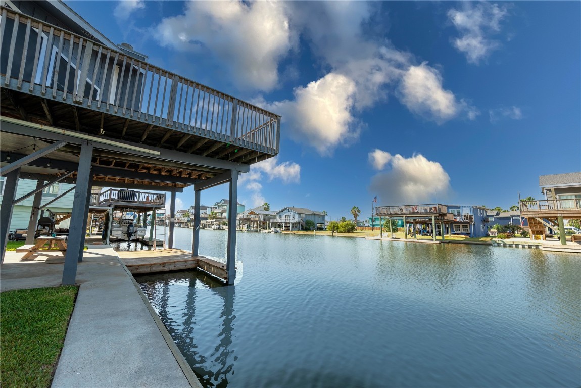 4729 Jolly Roger Road Jamaica Beach, TX 77554 - Photo 6 of 45 a view of a swimming pool with lounge chairs