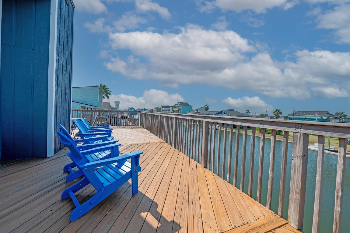 4729 Jolly Roger Road Jamaica Beach, TX 77554 - Photo 10 of 45 a view of a balcony with wooden floor and city view