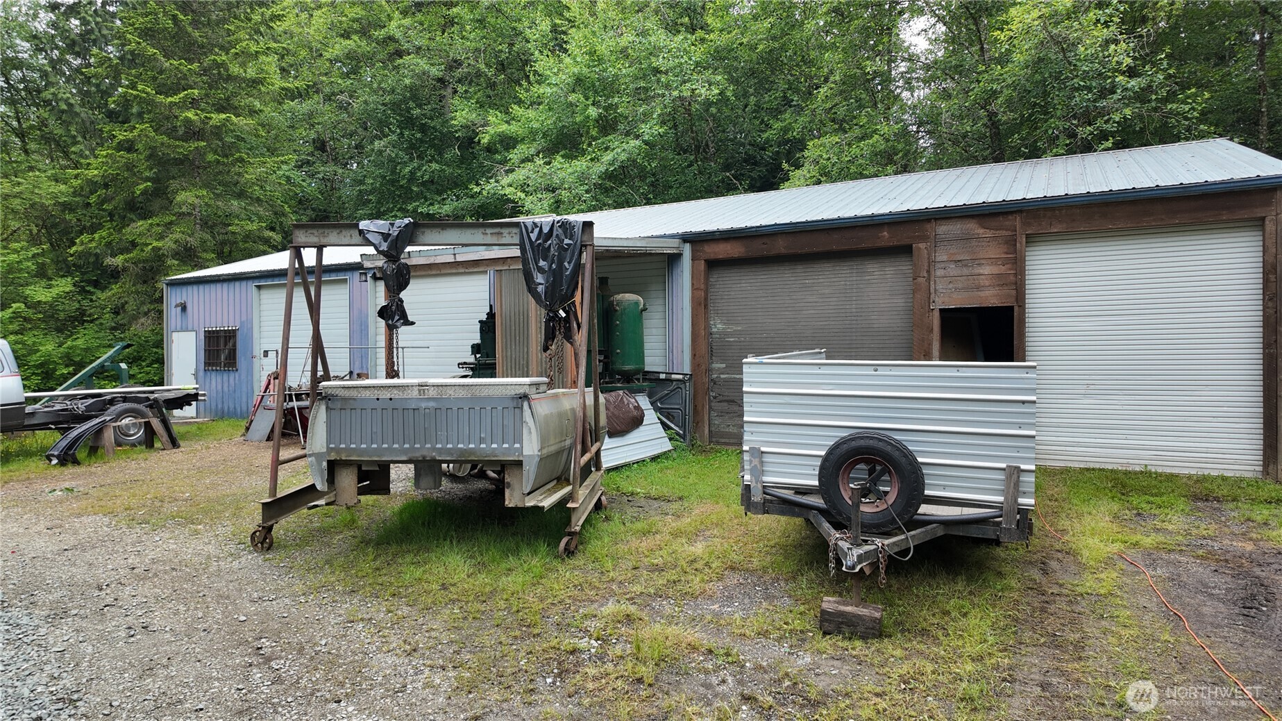 2909 Overpass Road Bow, WA 98232 - Photo 37 of 40 a backyard of a house with barbeque oven table and chairs
