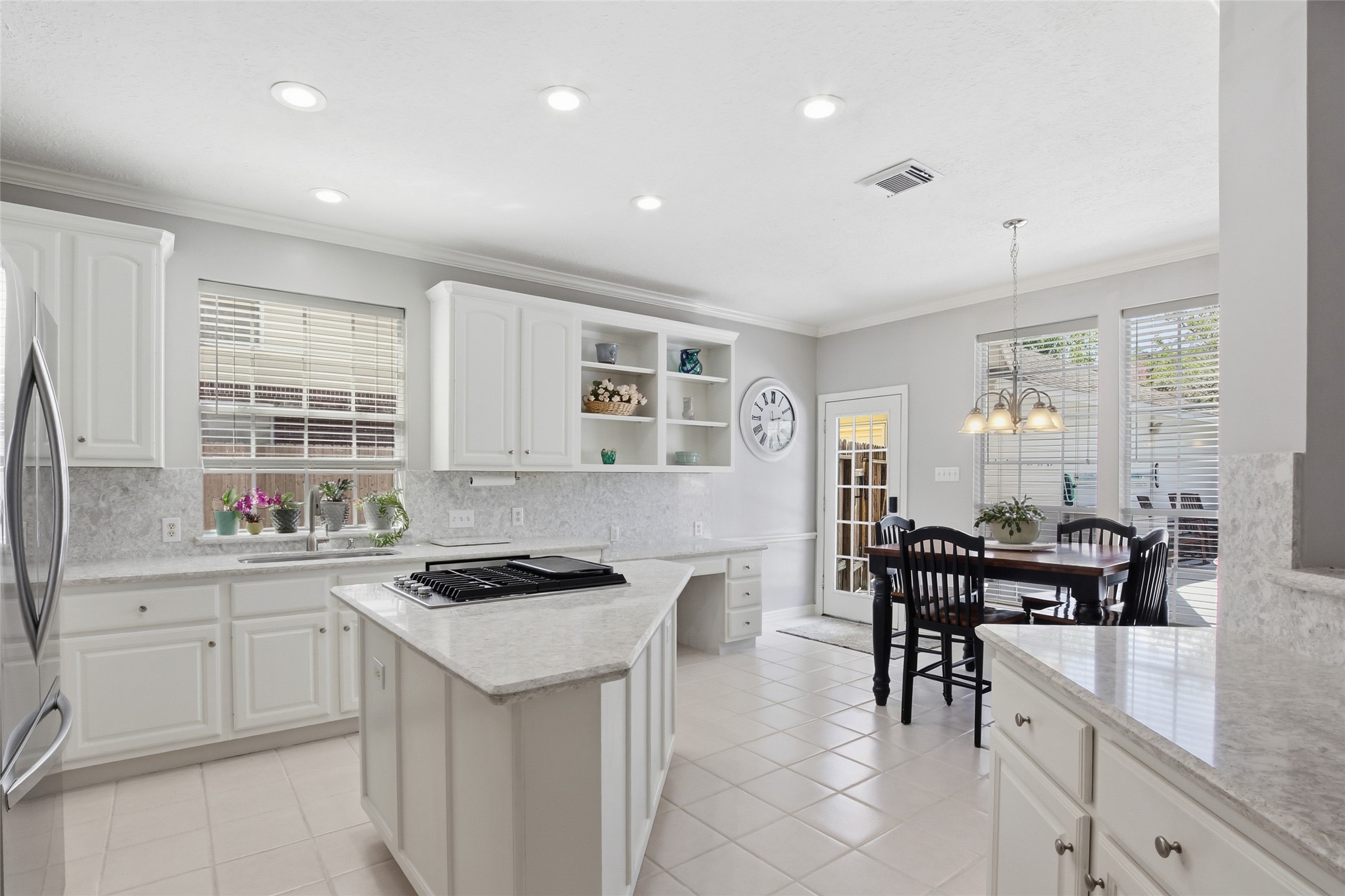 4411 Cedar Ridge Trail Houston, TX 77059 - Photo 17 of 32 a kitchen with granite countertop sink cabinets and stainless steel appliances