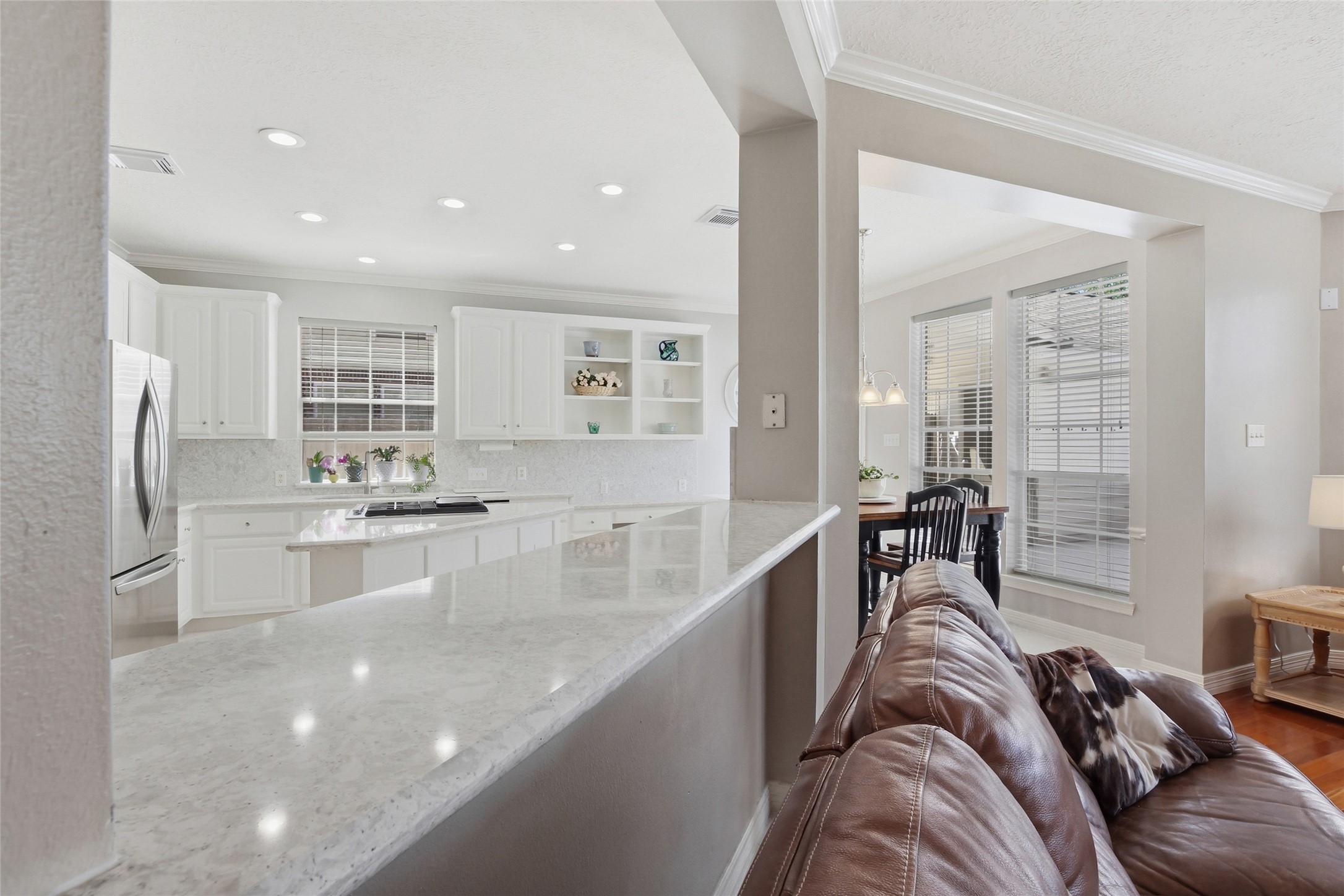 4411 Cedar Ridge Trail Houston, TX 77059 - Photo 18 of 32 a large kitchen with kitchen island a large counter top space a sink stainless steel appliances and cabinets