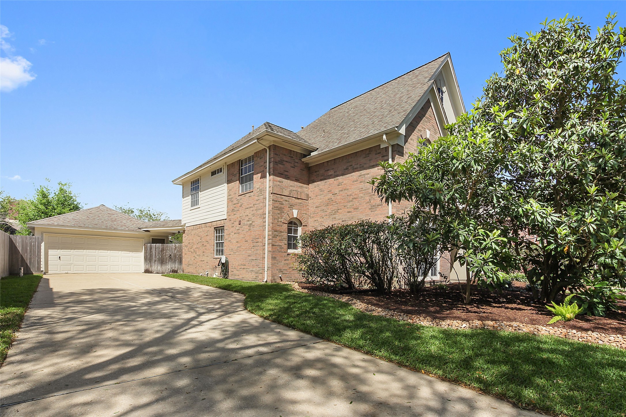 4411 Cedar Ridge Trail Houston, TX 77059 - Photo 4 of 32 a front view of a house with a yard and garage