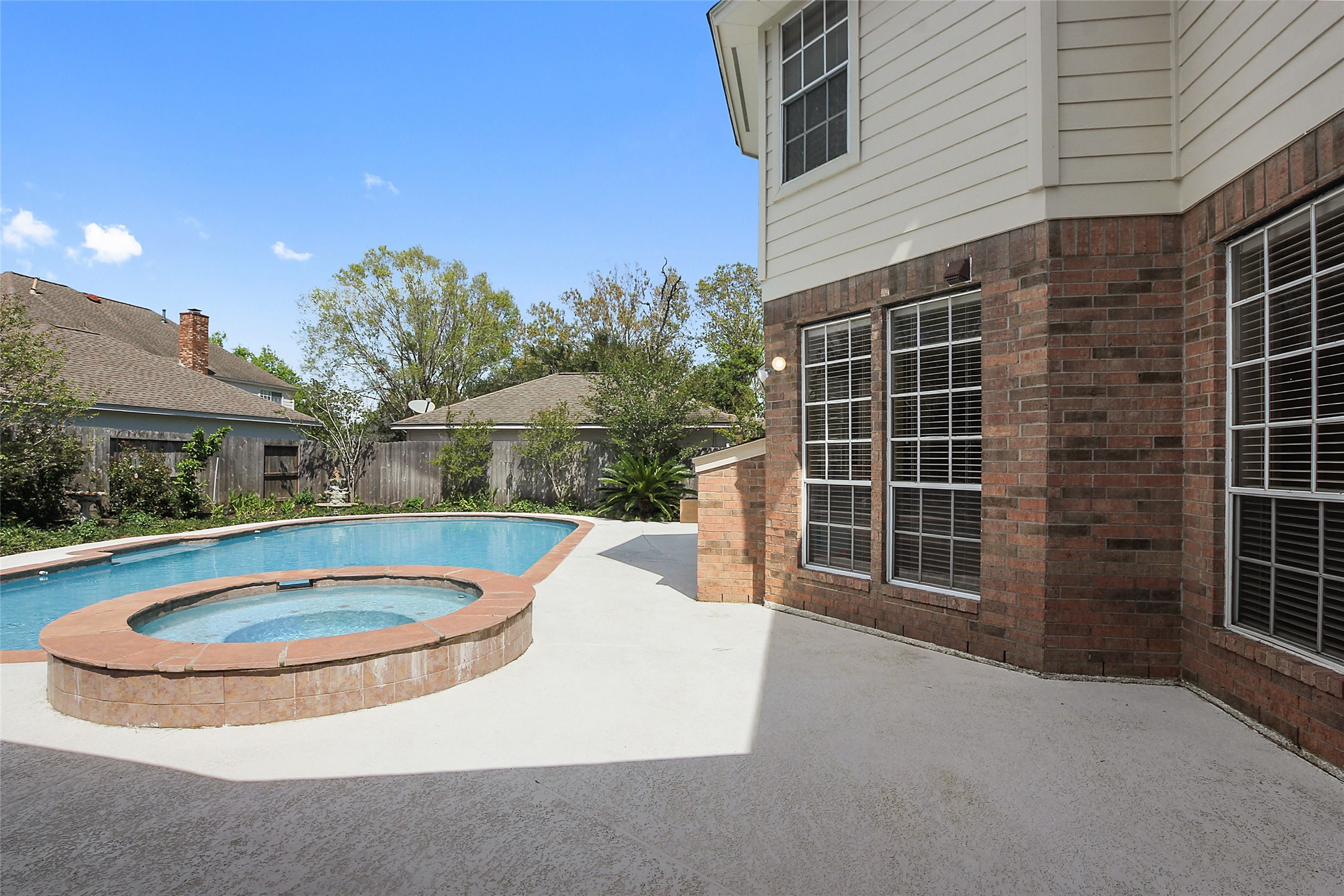4411 Cedar Ridge Trail Houston, TX 77059 - Photo 5 of 32 a view of a house with a swimming pool and sitting area