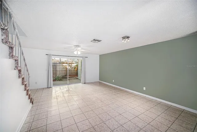 a view of an empty room with a window