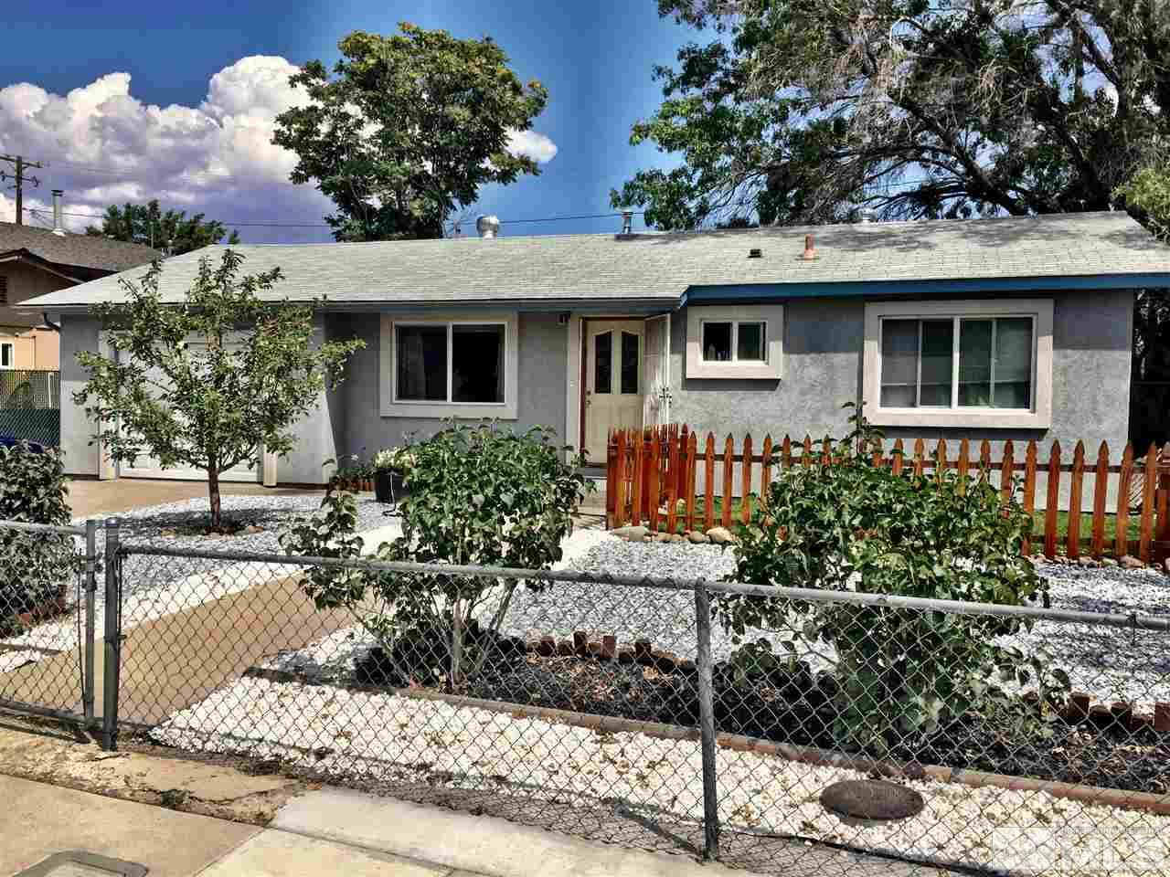 1280 Manhattan Street Reno, NV 89512 - Photo 1 of 1 a front view of a house with a yard
