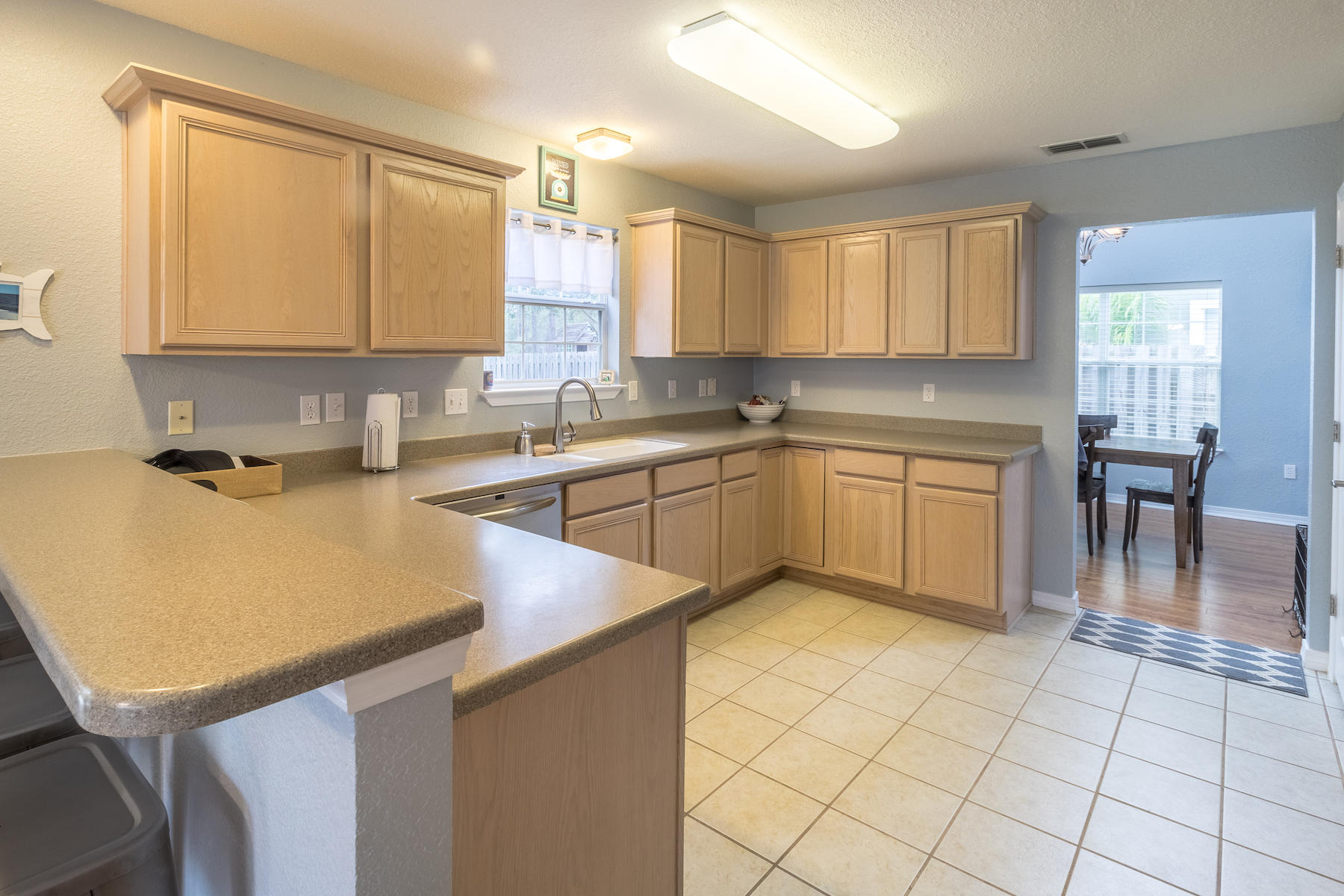 86 Red Maple Court Santa Rosa Beach, FL 32459 - Photo 16 of 32 a kitchen with a sink and cabinets