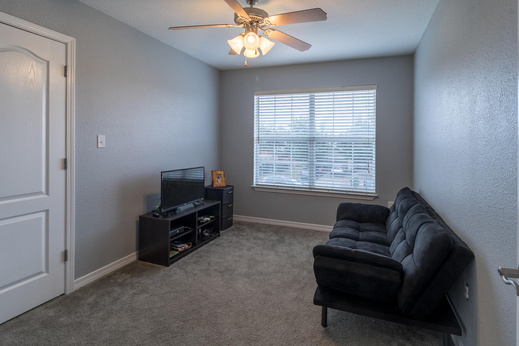 86 Red Maple Court Santa Rosa Beach, FL 32459 - Photo 32 of 32 a living room with furniture and a flat screen tv