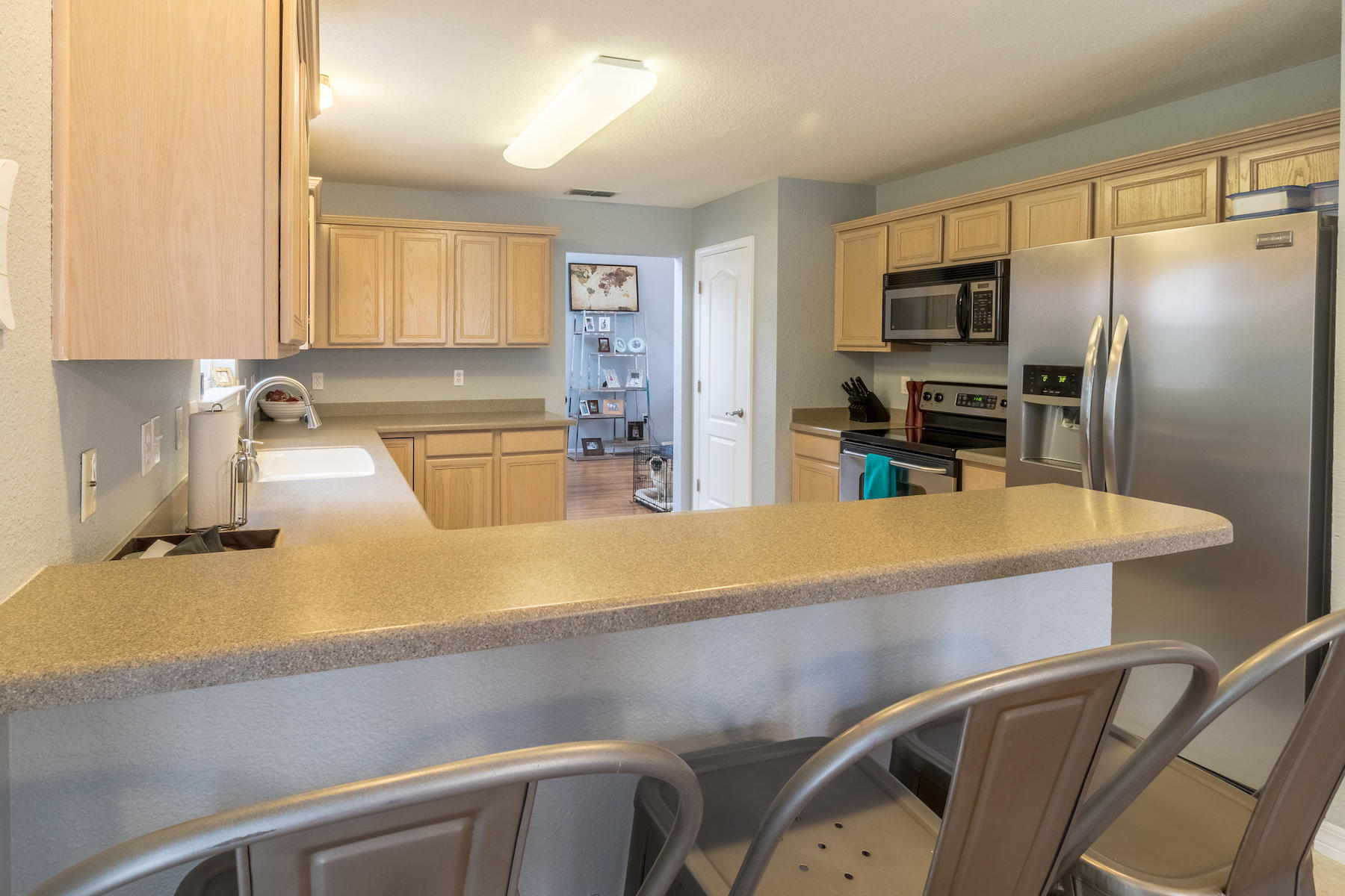 86 Red Maple Court Santa Rosa Beach, FL 32459 - Photo 6 of 32 a kitchen with kitchen island a counter appliances cabinets and a sink