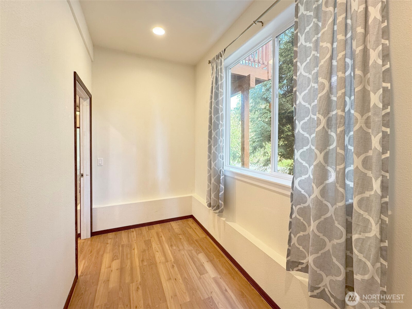 60 Alderwood Drive Sequim, WA 98382 - Photo 29 of 40 a view of bathroom with a large window and wooden floor