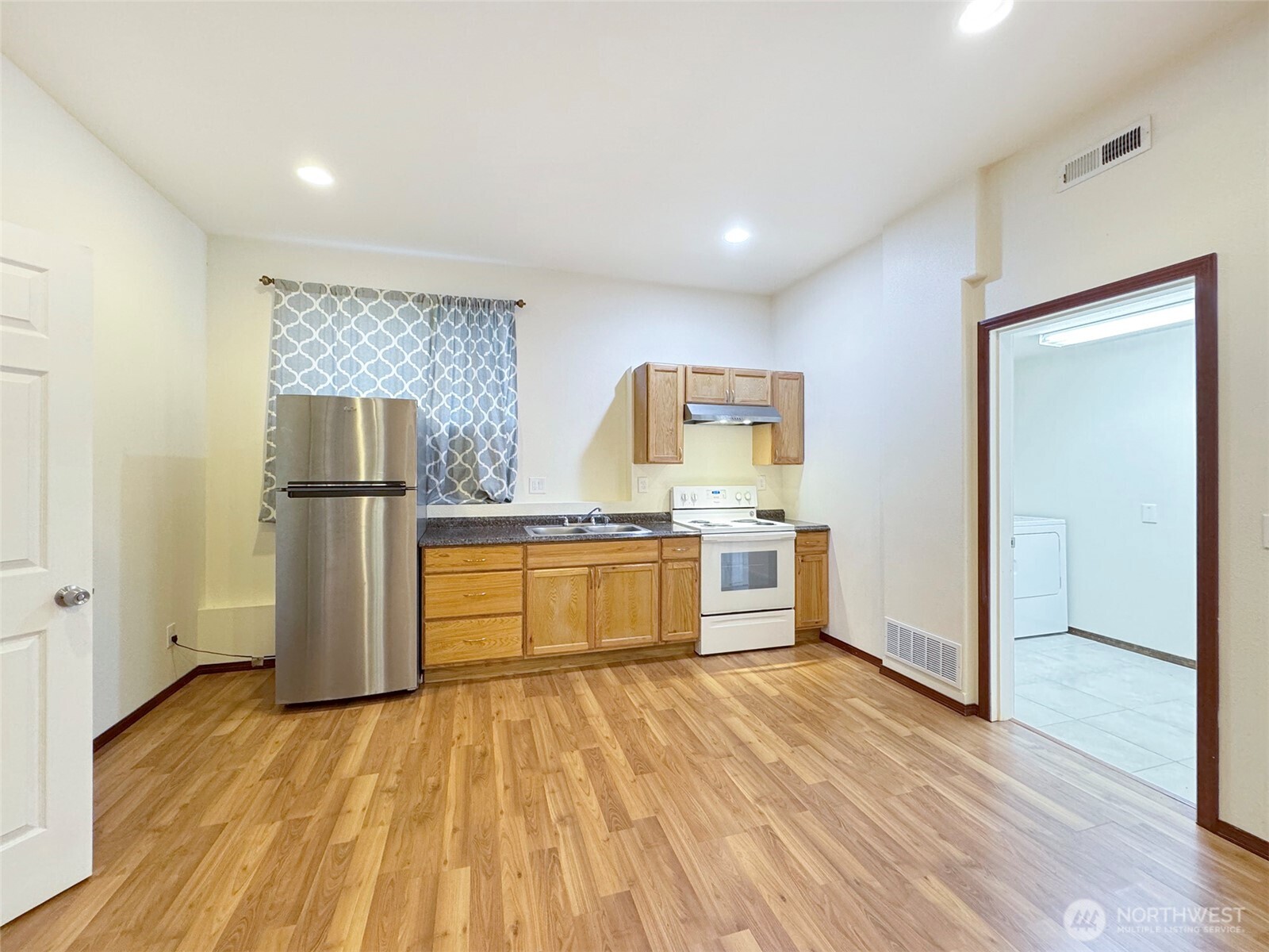 60 Alderwood Drive Sequim, WA 98382 - Photo 30 of 40 a kitchen with stainless steel appliances a refrigerator and a stove top oven
