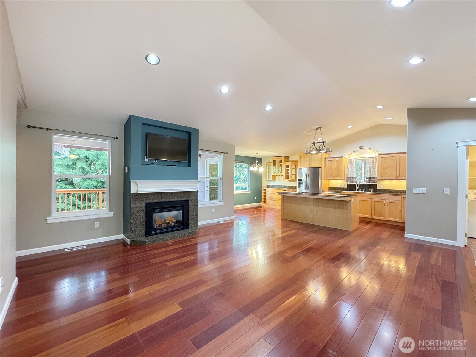 60 Alderwood Drive Sequim, WA 98382 - Photo 3 of 40 a view of kitchen livingroom with fireplace wooden floor and windows