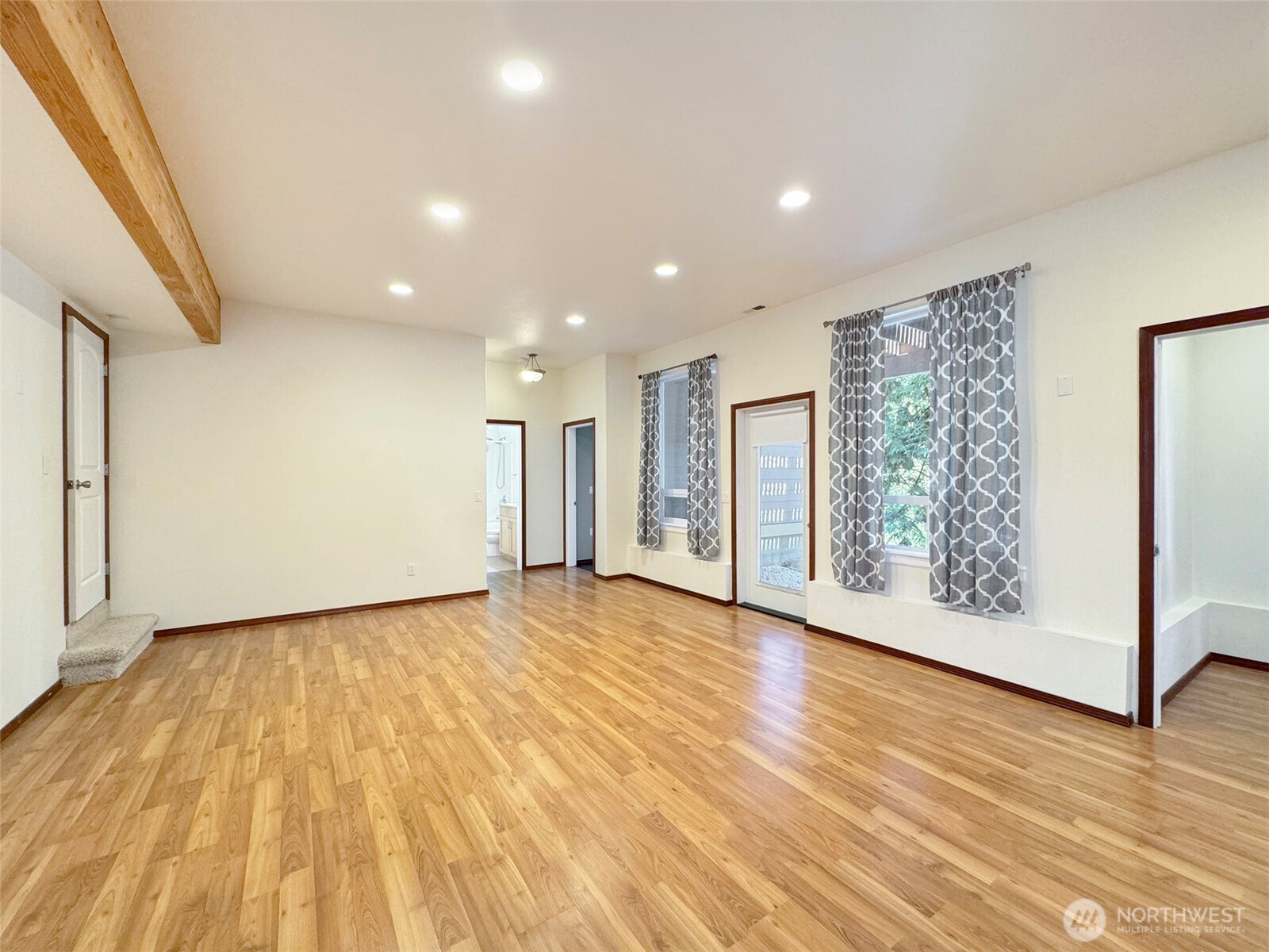 60 Alderwood Drive Sequim, WA 98382 - Photo 32 of 40 a view of an empty room with wooden floor and a window