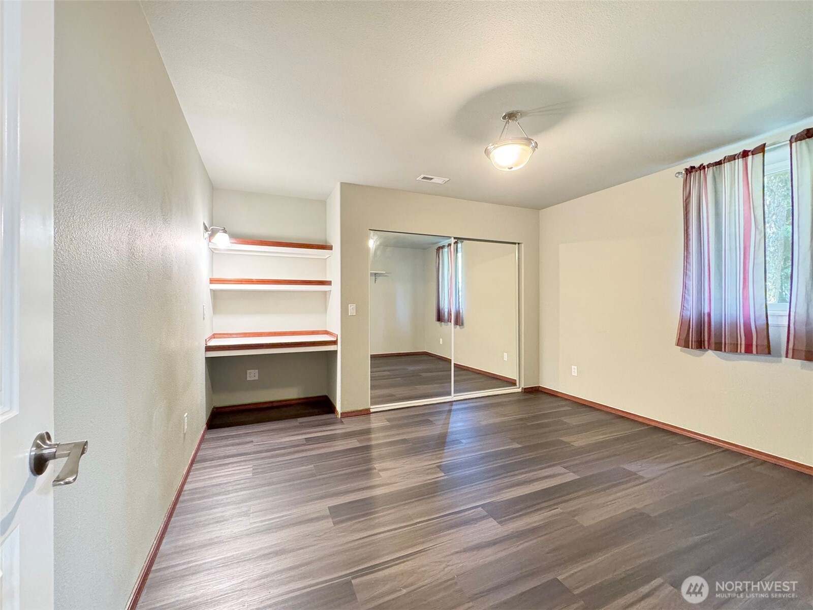 60 Alderwood Drive Sequim, WA 98382 - Photo 36 of 40 wooden floor in an empty room with a window