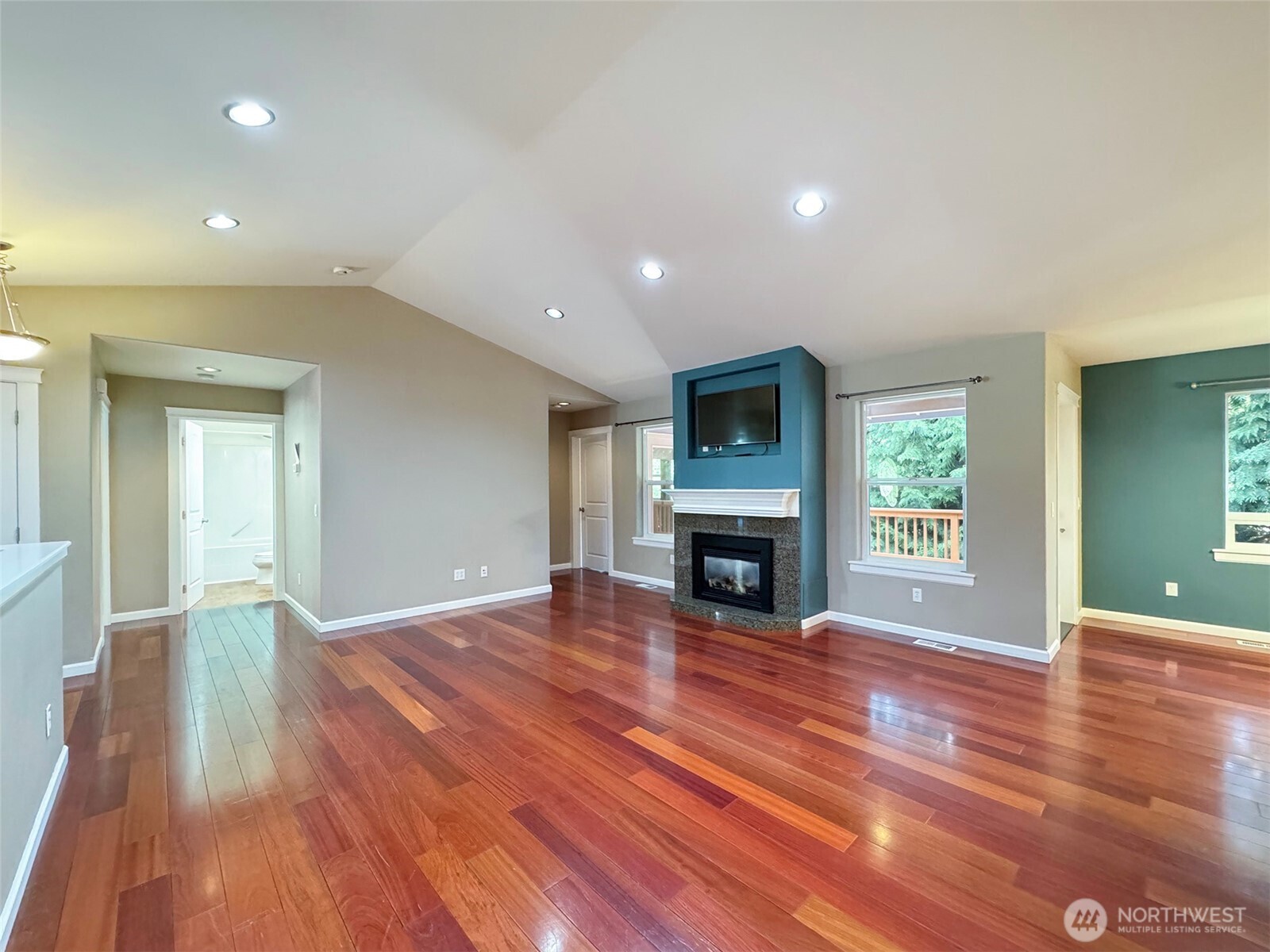 60 Alderwood Drive Sequim, WA 98382 - Photo 5 of 40 a view of empty room with fireplace and wooden floor