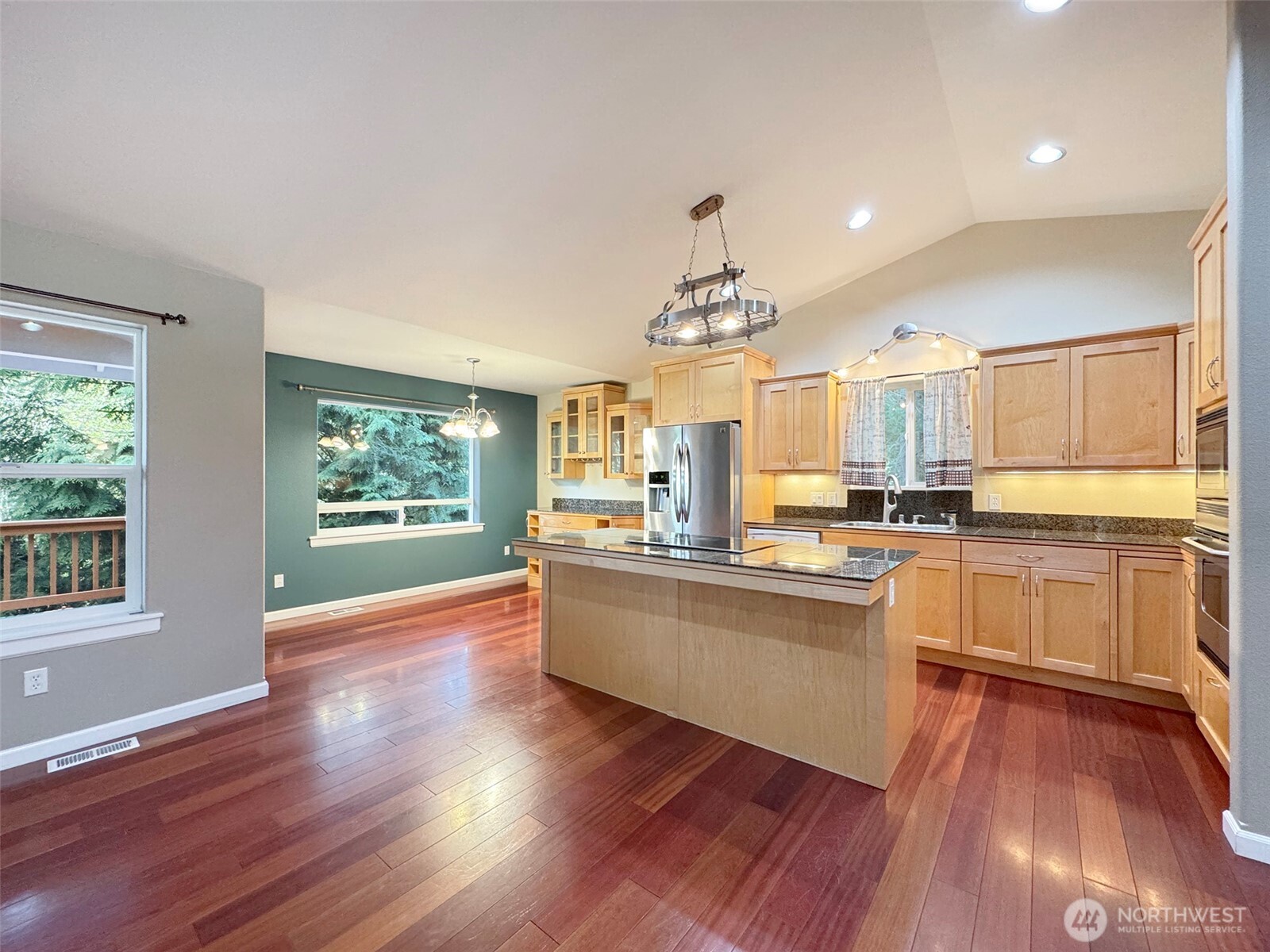 60 Alderwood Drive Sequim, WA 98382 - Photo 6 of 40 a large kitchen with cabinets wooden floor and stainless steel appliances