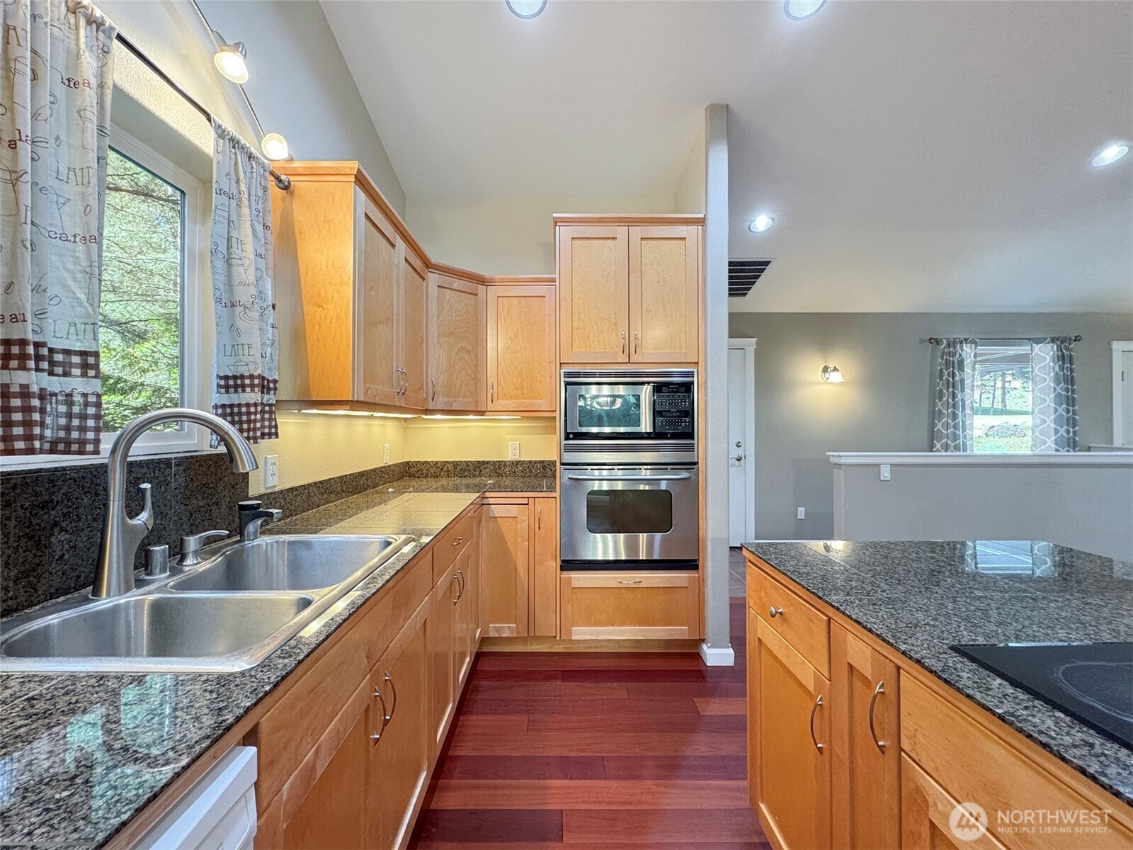 60 Alderwood Drive Sequim, WA 98382 - Photo 8 of 40 a kitchen with stainless steel appliances granite countertop a sink a counter space and a window