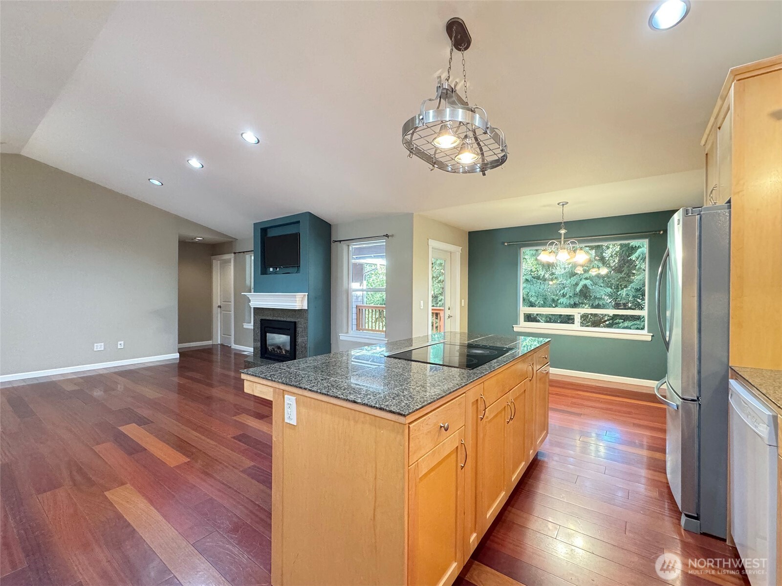 60 Alderwood Drive Sequim, WA 98382 - Photo 9 of 40 an open kitchen with a center island wooden floor and stainless steel appliances