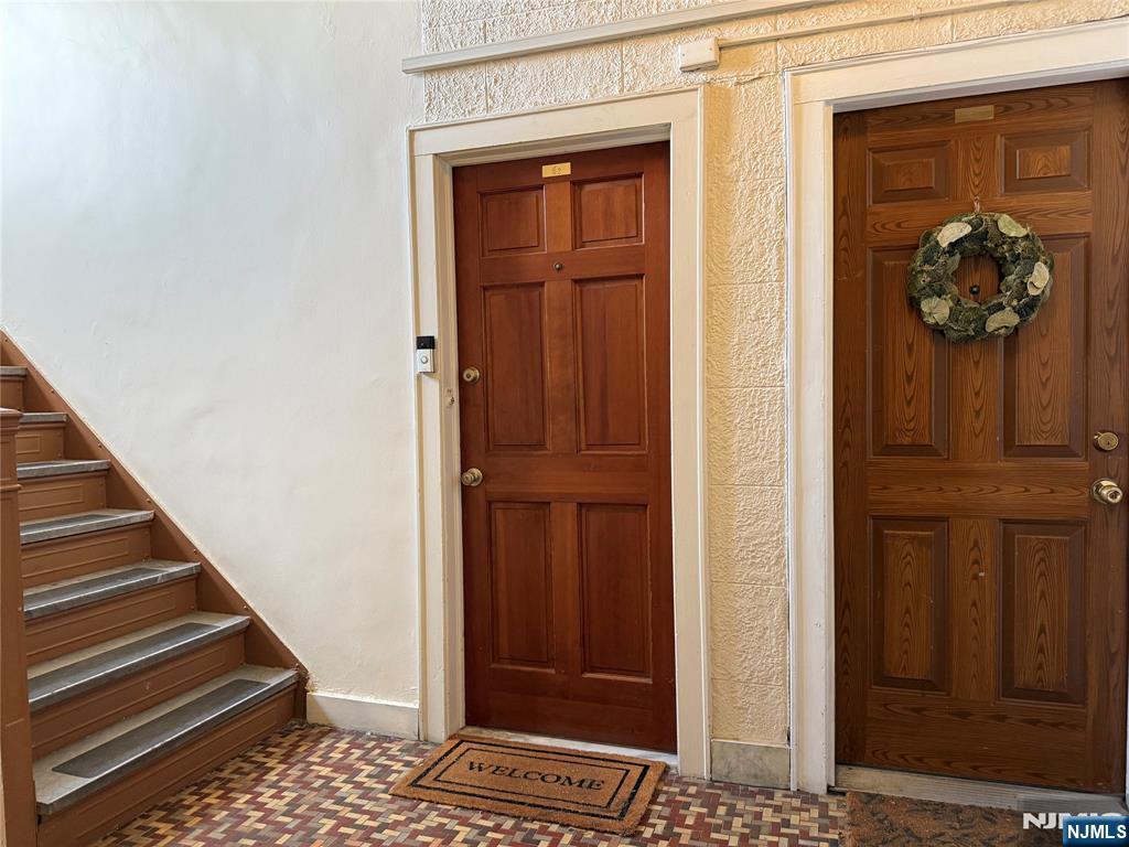 215 Orient Way, Unit C2 Rutherford, NJ 07070 - Photo 21 of 25 a view of a hallway with wooden floor and front door