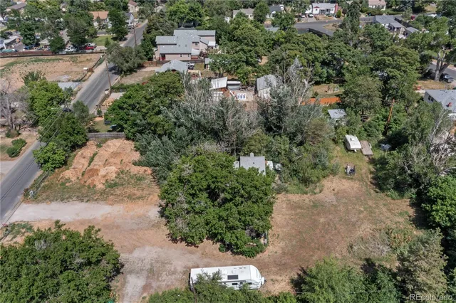 an aerial view of a houses with outdoor space
