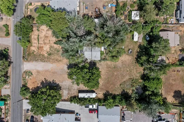an aerial view of a house with yard