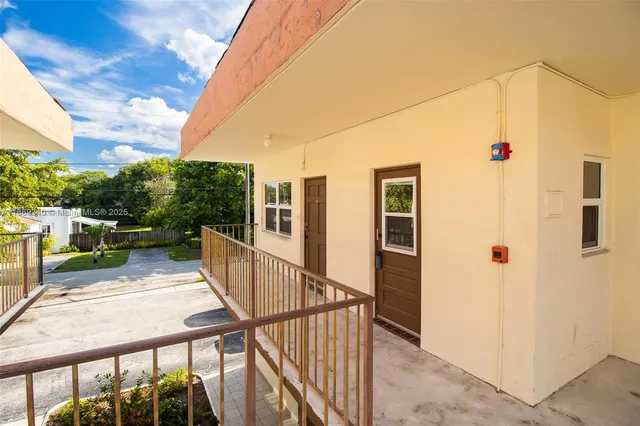 a view of balcony with furniture