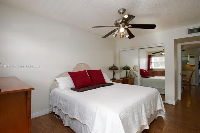 a bedroom with bed and window