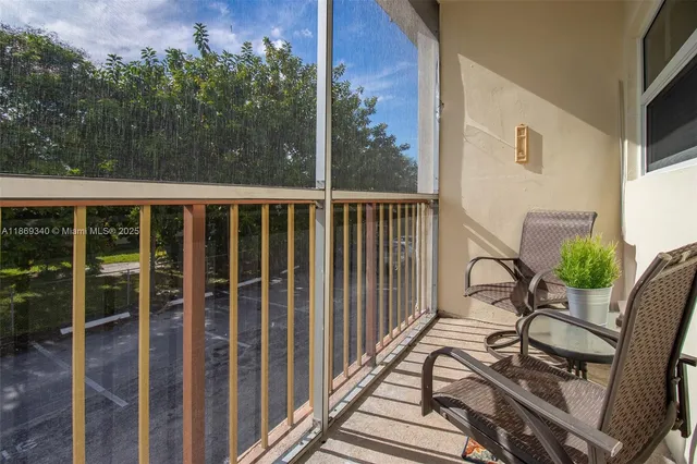 a view of balcony with furniture