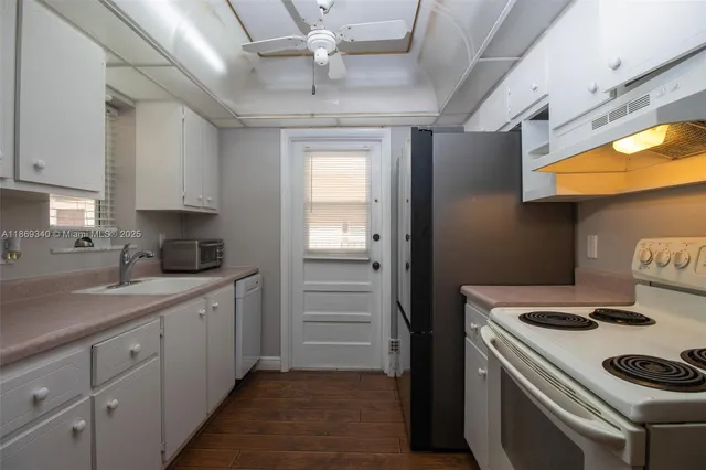 a kitchen with a stove and a refrigerator