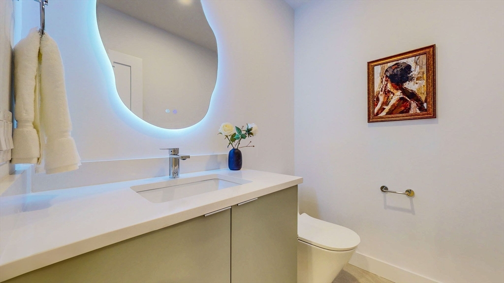 140 Columbia Street, Unit 1 Brookline, MA 02446 - Photo 24 of 41 a bathroom with a sink and a mirror