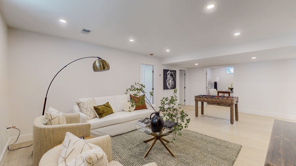 140 Columbia Street, Unit 1 Brookline, MA 02446 - Photo 26 of 41 a living room with furniture