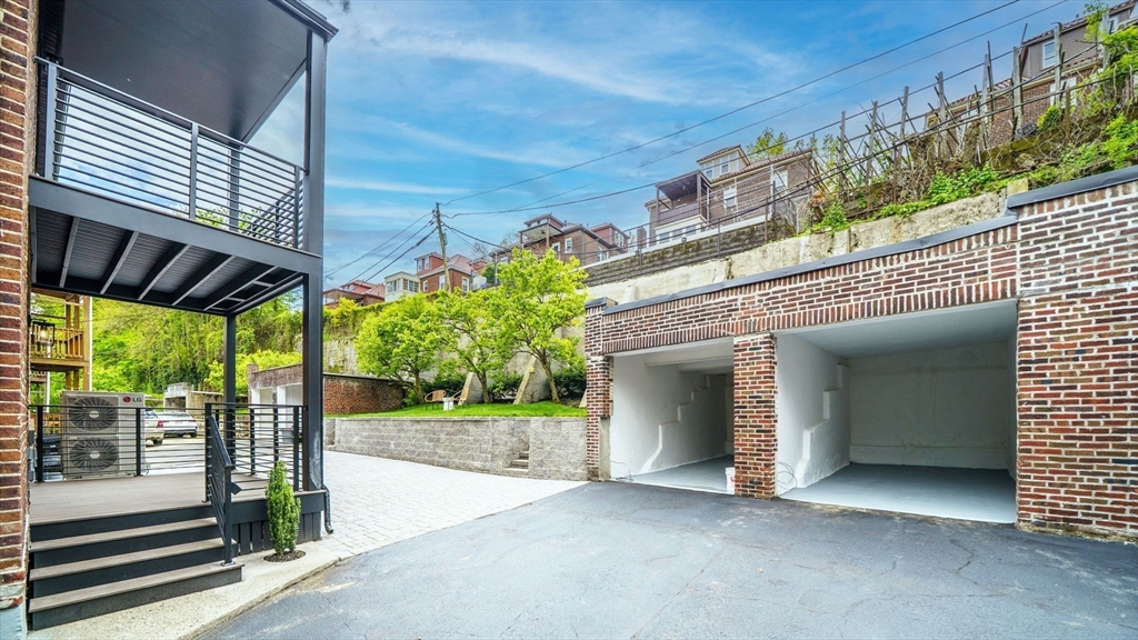 140 Columbia Street, Unit 1 Brookline, MA 02446 - Photo 37 of 41 a view of a entrance gate of a building