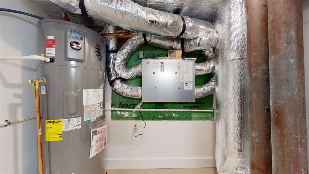 140 Columbia Street, Unit 1 Brookline, MA 02446 - Photo 41 of 41 a view of store room with washer and dryer