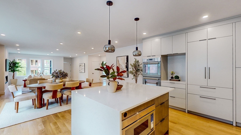140 Columbia Street, Unit 1 Brookline, MA 02446 - Photo 7 of 41 a view of a kitchen and dining room