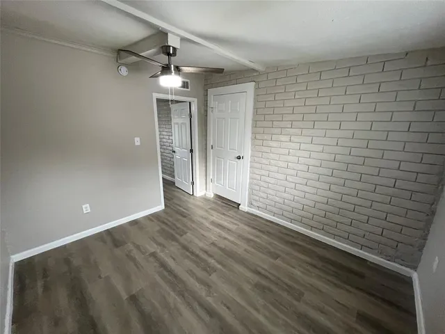 a view of a livingroom with wooden floor