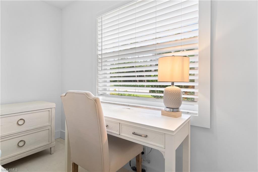 900 8th Avenue South, Unit 105 Naples, FL 34102 - Photo 11 of 20 a view of storage and utility room with washer and dryer