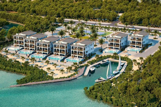 an aerial view of a house with a garden and lake view