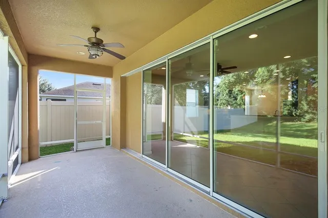 a view of yard with swimming pool and green space