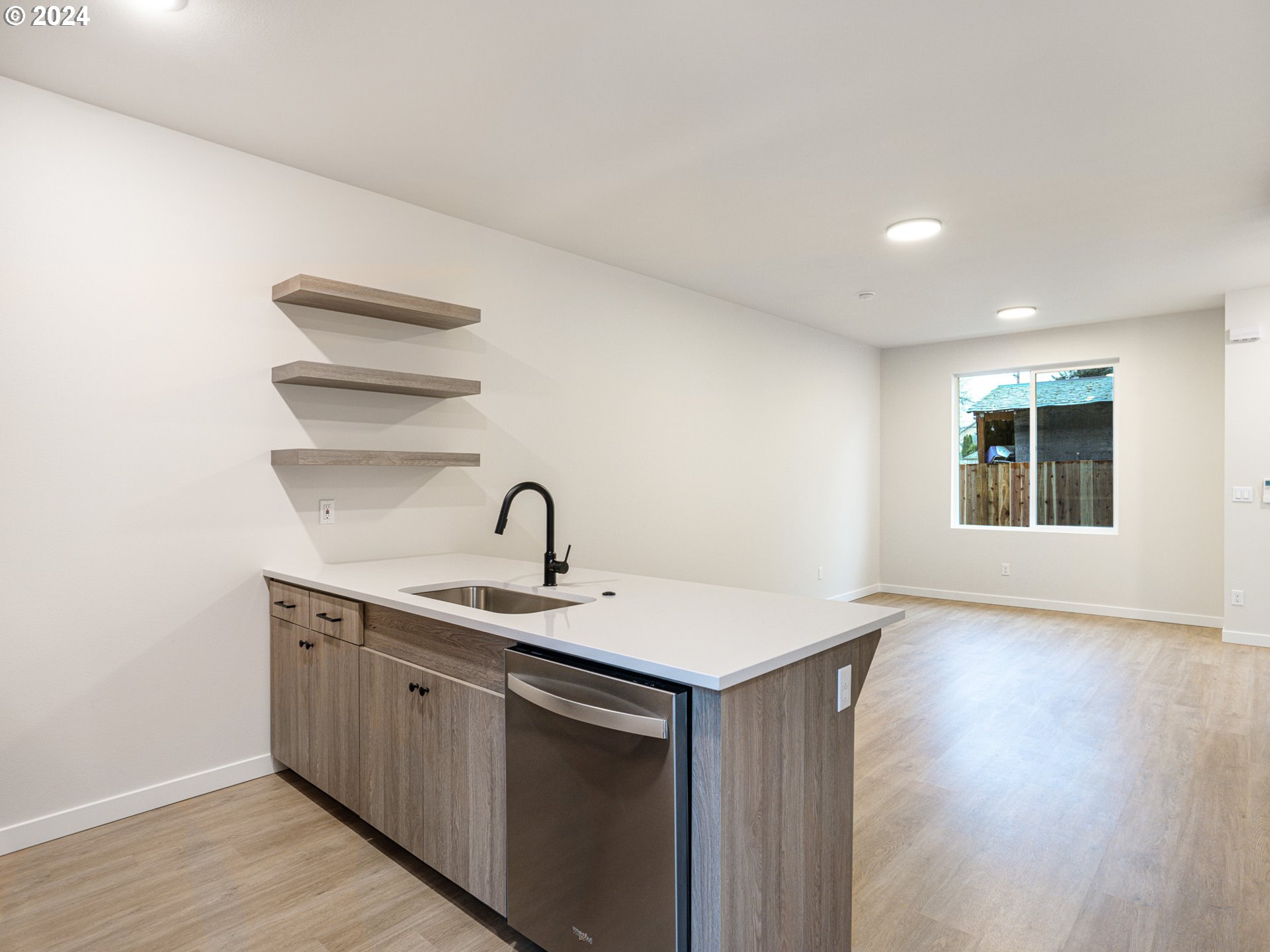 8524 North Endicott Avenue, Unit 2 Portland, OR 97217 - Photo 6 of 12 a kitchen with a sink cabinets and wooden floor