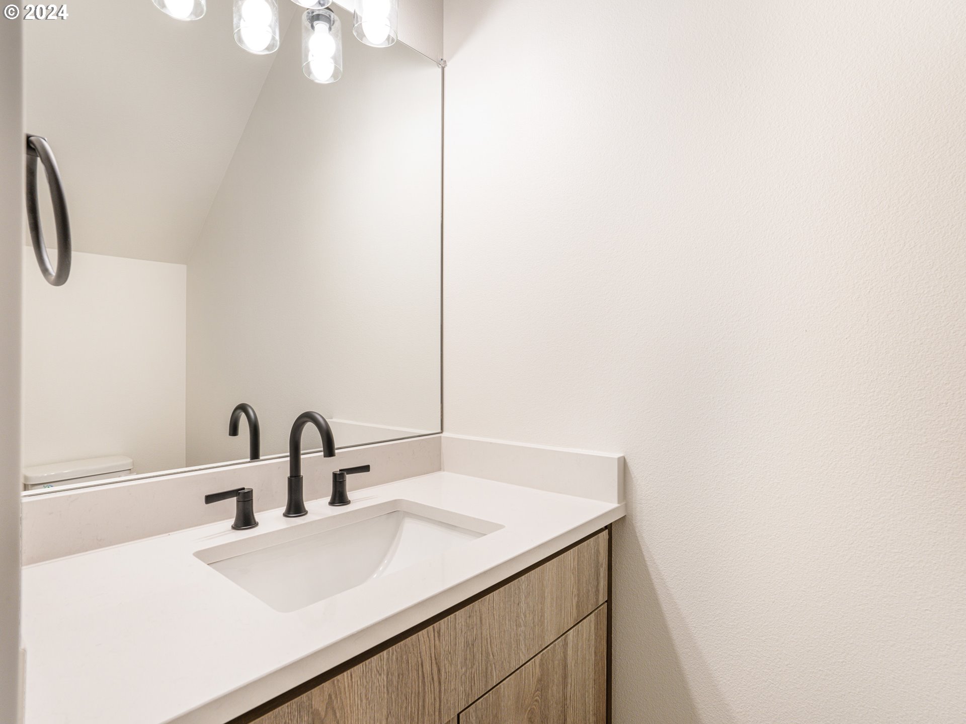 8524 North Endicott Avenue, Unit 2 Portland, OR 97217 - Photo 7 of 12 a bathroom with a sink and a mirror