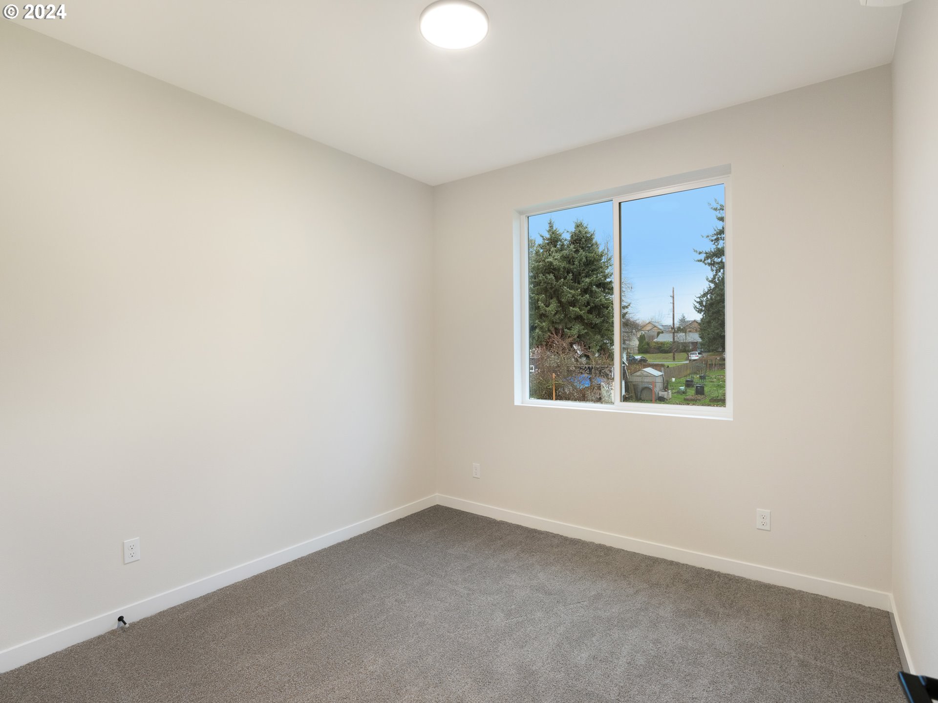 8524 North Endicott Avenue, Unit 2 Portland, OR 97217 - Photo 8 of 12 an empty room with a window