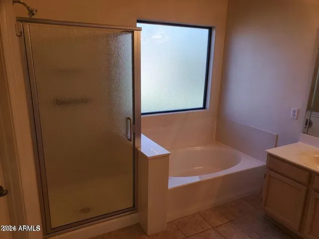 a white toilet sitting next to a shower