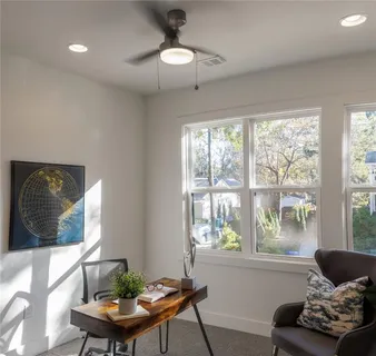 a bathroom with a granite countertop sink and shower