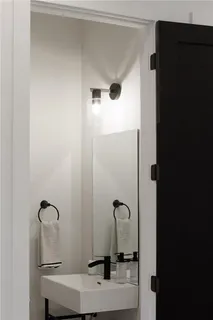 a bathroom with a toilet sink and shower