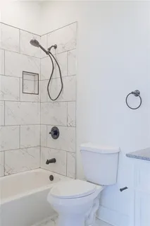 a view of a hallway with a wooden door