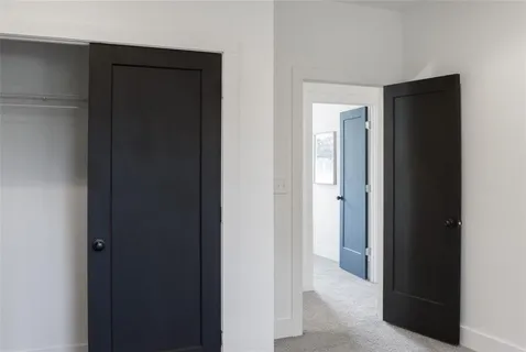 a bathroom with a shower and mirror