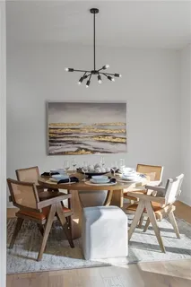 a workspace with furniture and chandelier