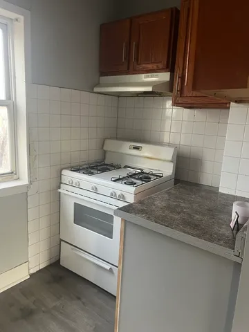 a kitchen with a stove and a sink