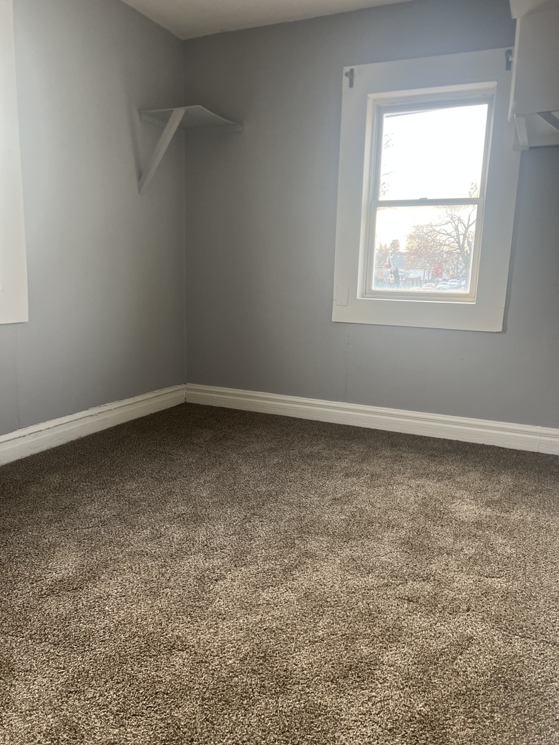 15704 Willard Avenue Harvey, IL 60426 - Photo 23 of 26 an empty room with a window