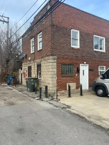 a view of a house with a yard and garage